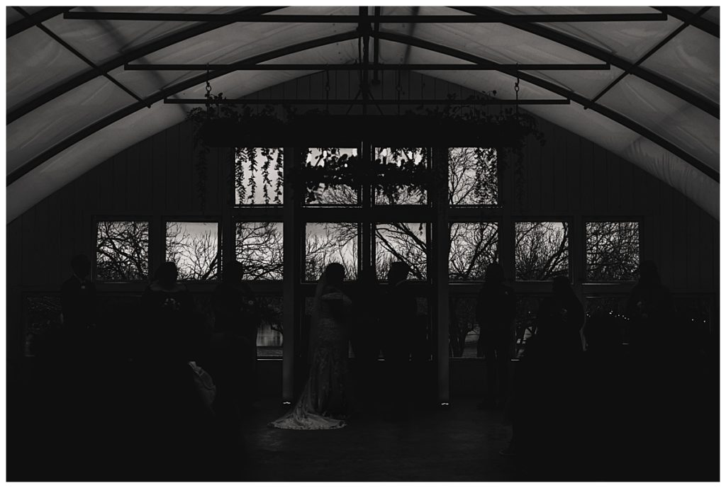 silhouettes of couple at altar by Austin wedding photographer