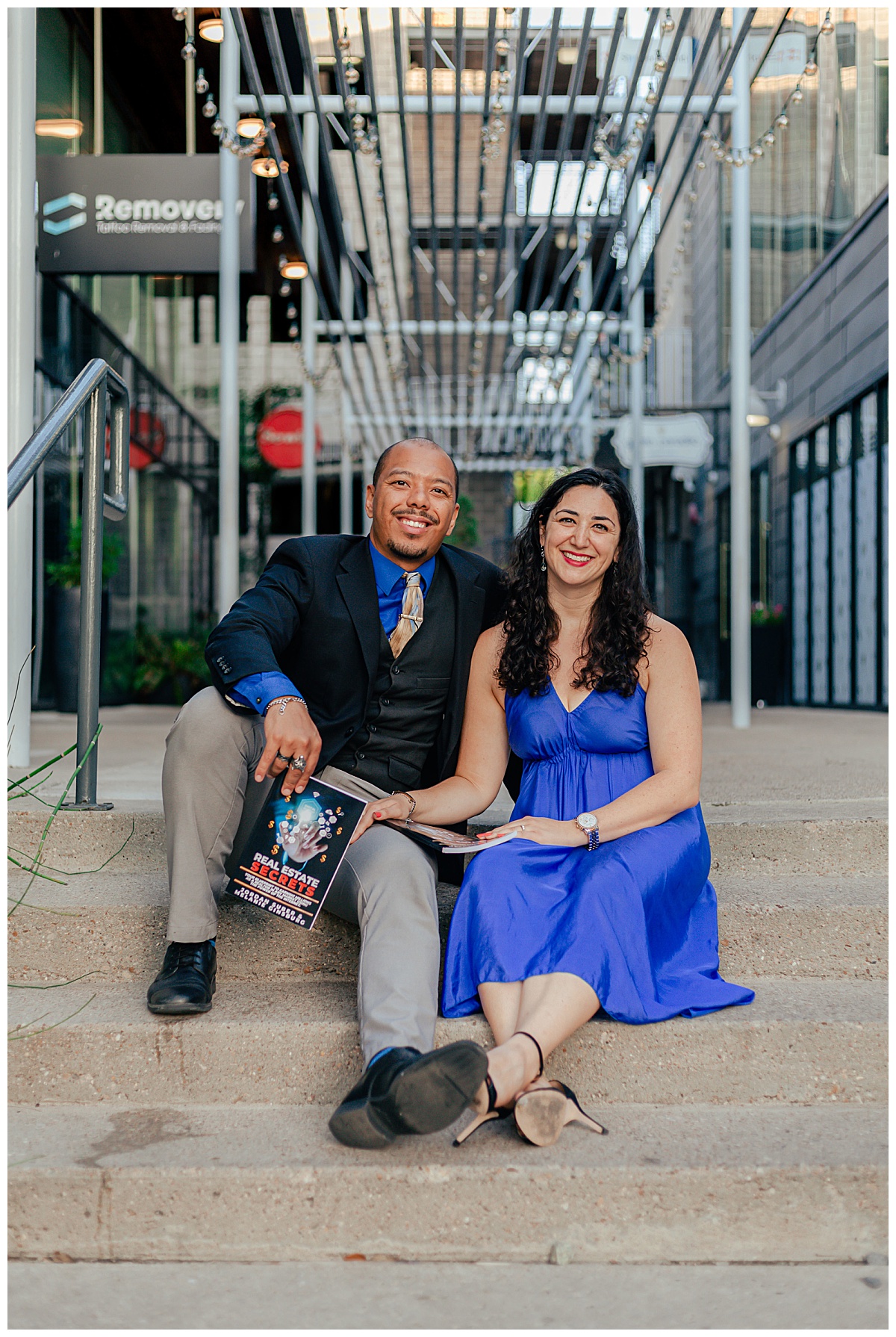 business partners sit together on steps by Austin wedding photographer