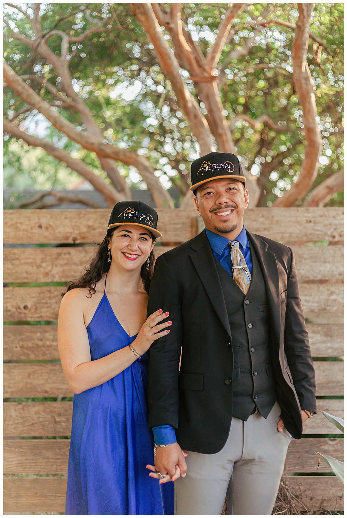 man and woman in hats smile by Ellie Chavez Photography