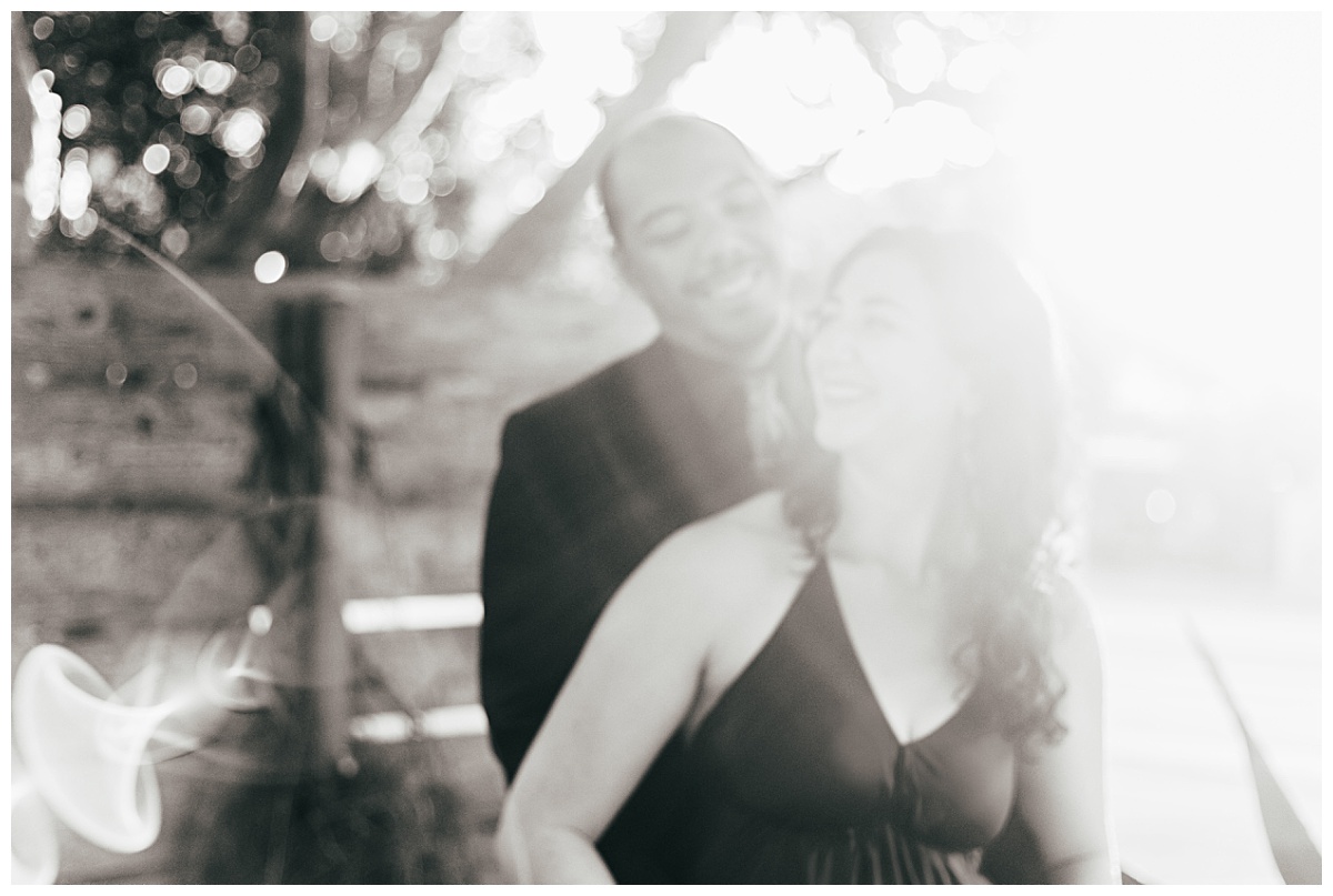 light blurs out husband and wife standing together by Austin wedding photographer
