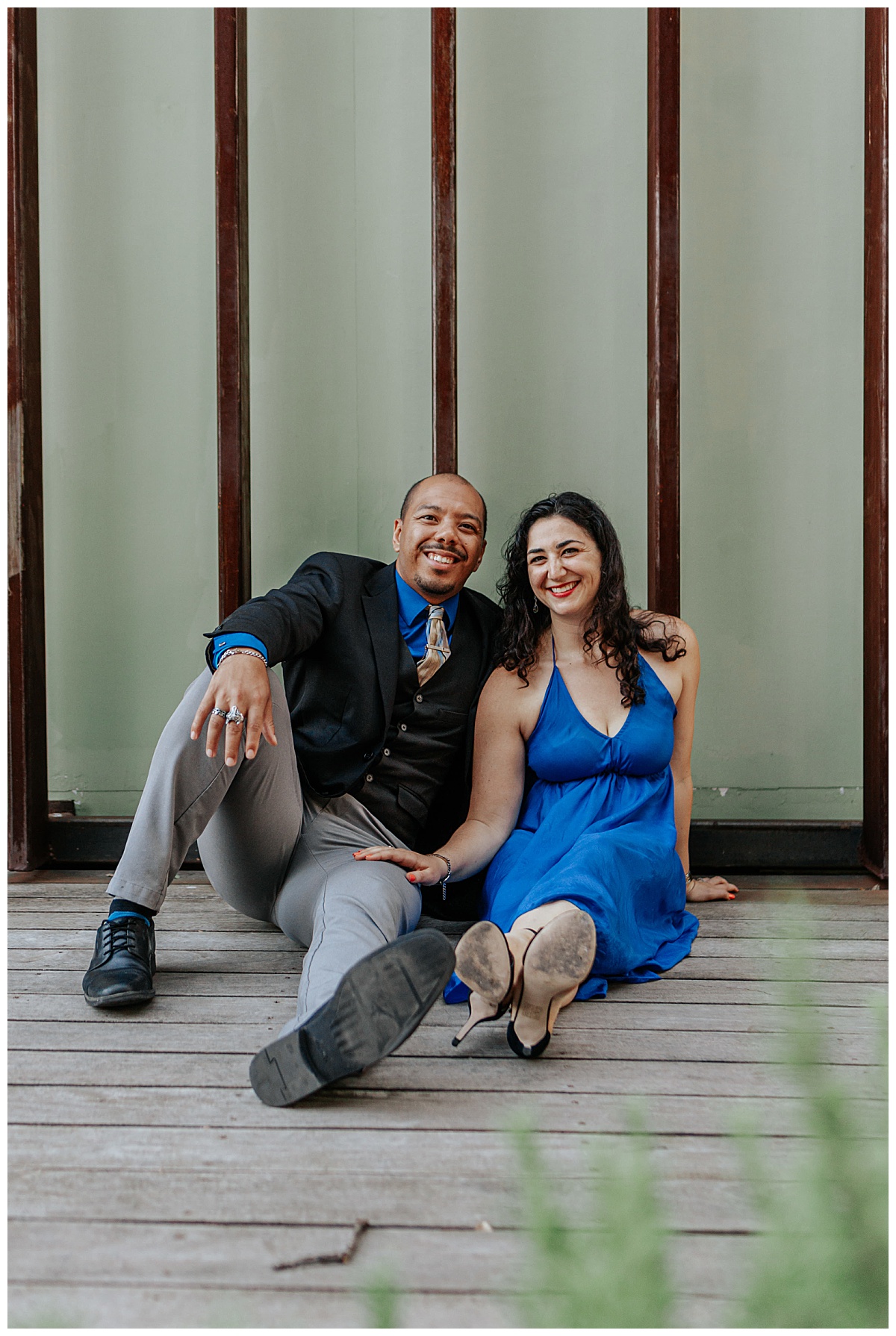 couple sits together in front of beams for South Congress couple's shoot