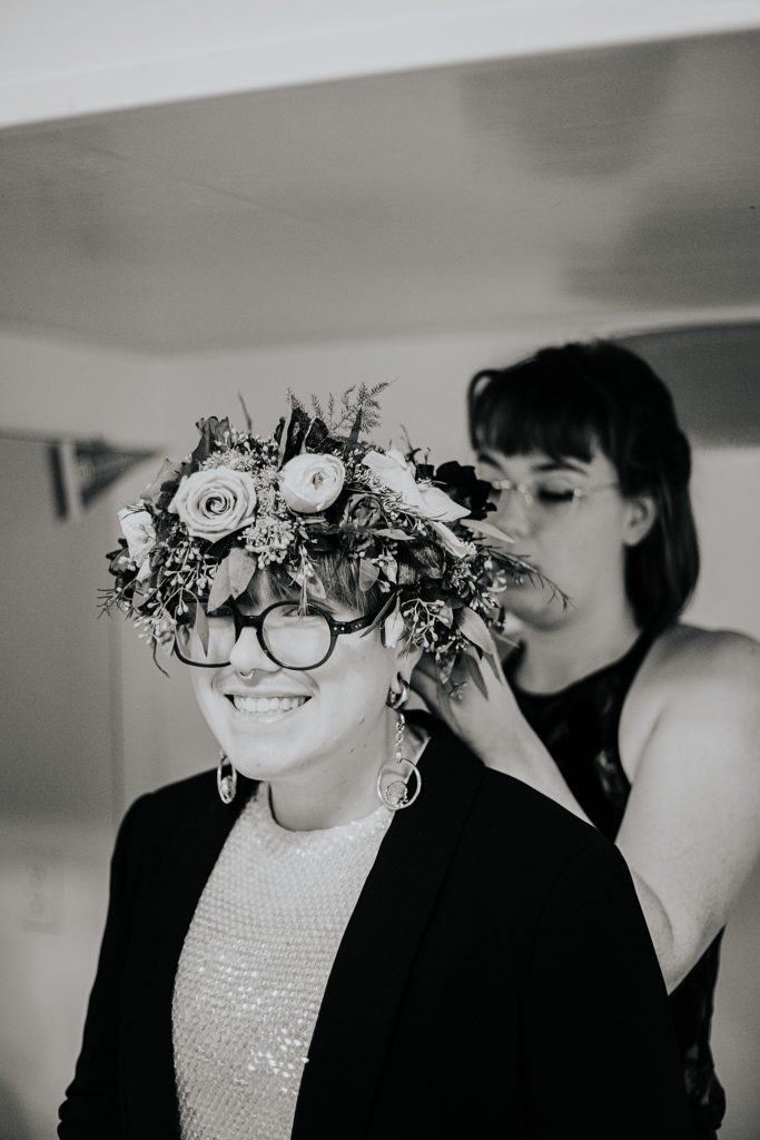hair stylist ties floral headpiece on for intimate Lago Vista ceremony