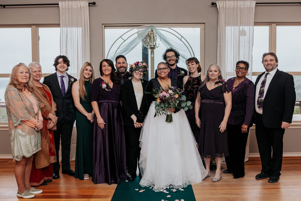 family and friends stand together during celebration by Austin Wedding Photographer