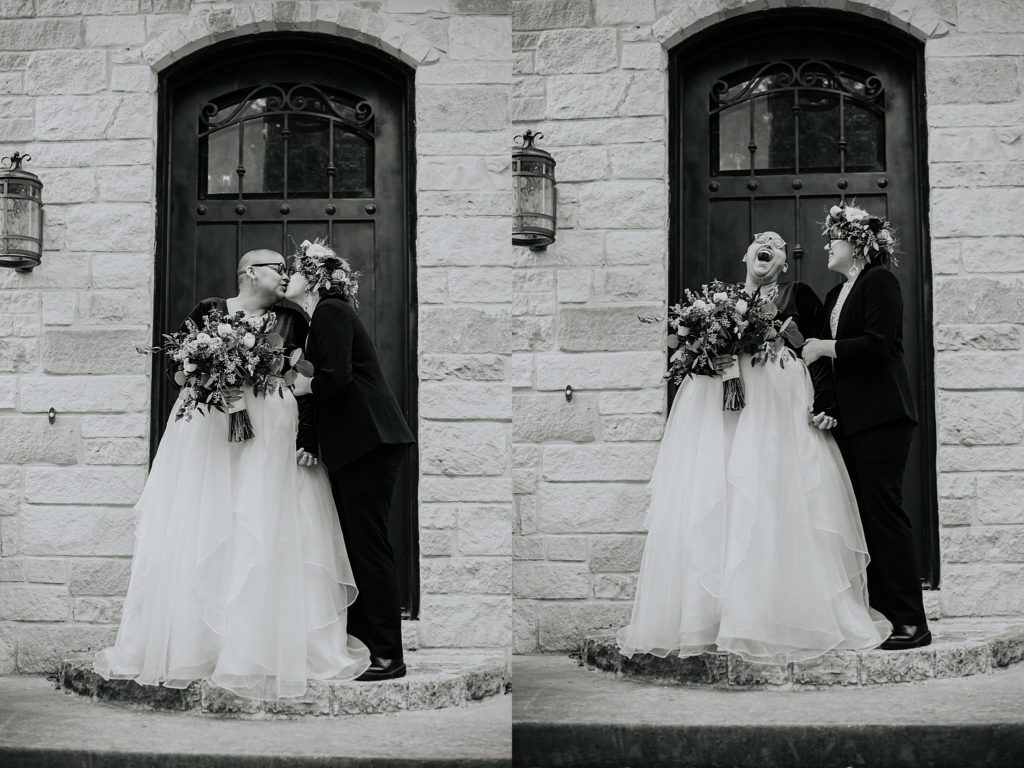 partners kiss and laugh together outside stone building by Ellie Chavez Photography 