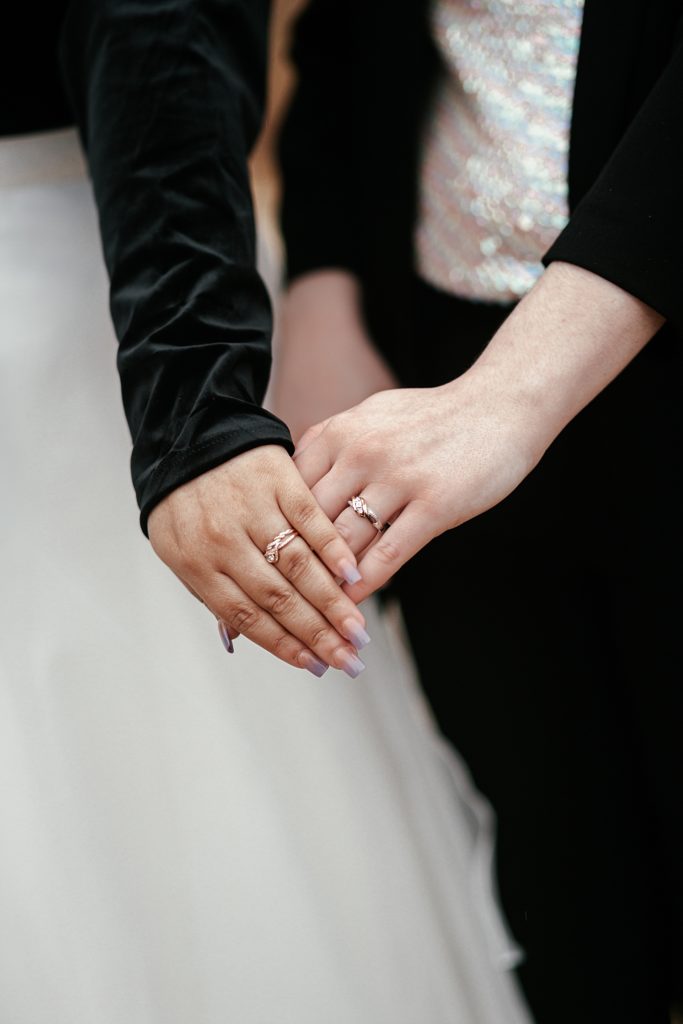 hands with wedding bands are crossed during intimate Lago Vista ceremony