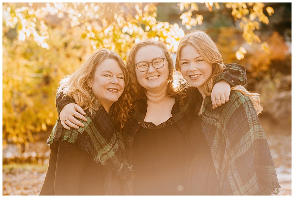 mother and daughters smile for Ellie Chavez Photography