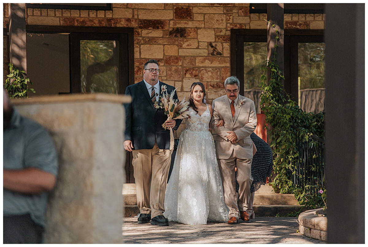 Father and grandfather walk bride down the aisle by Austin wedding photographer