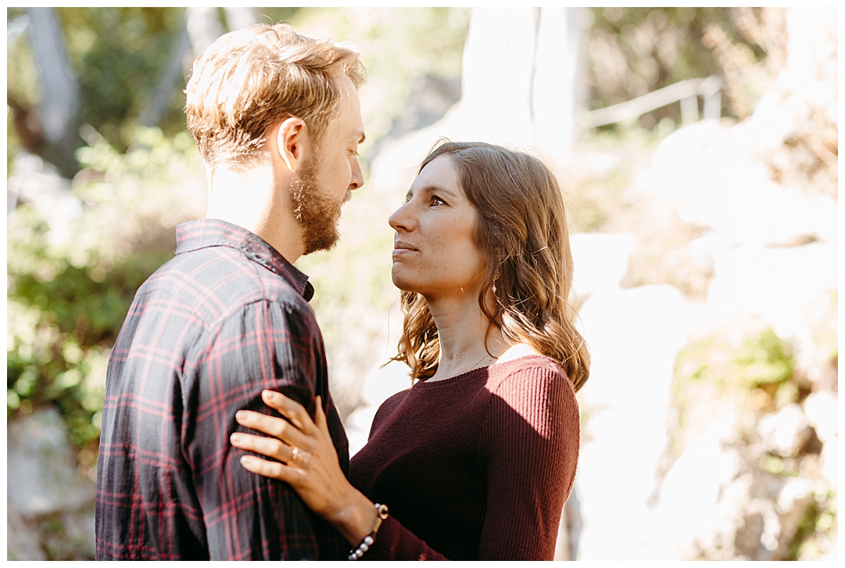 Fiances look into each others eyes at garden engagement session