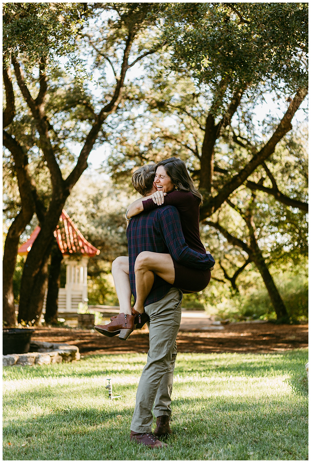 Man holds smiling woman by Ellie Chavez Photography