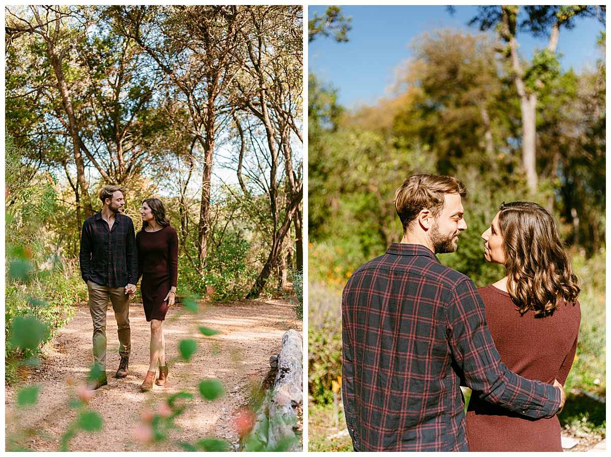 Couple looks at each other on path by Ellie Chavez Photography