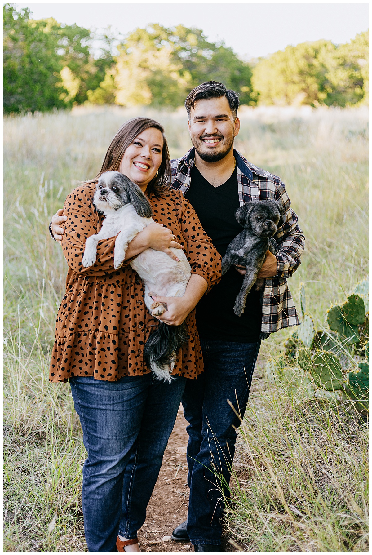 Couple holds dogs at St. Edwards Park engagement session