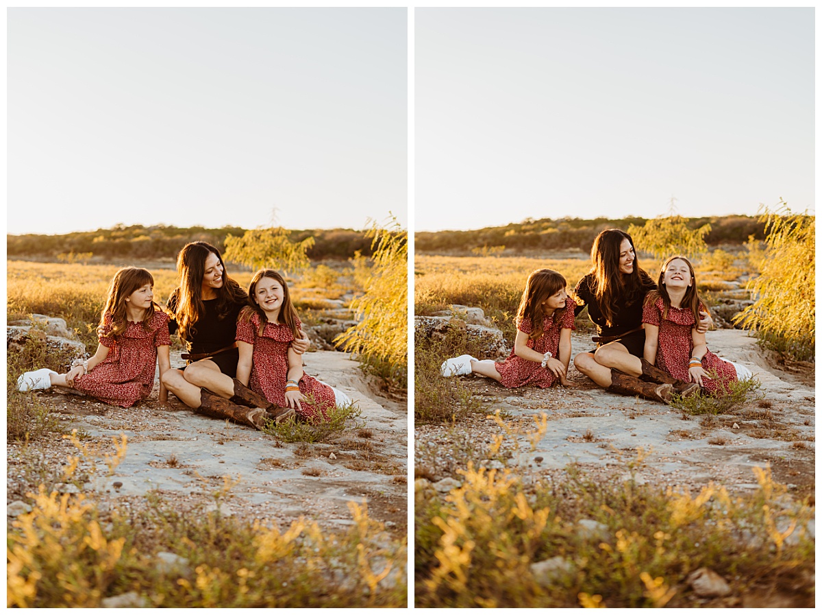 mother and daughters sit together smiling at Lago Vista family session